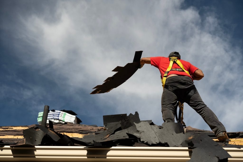 guy removing underlayment