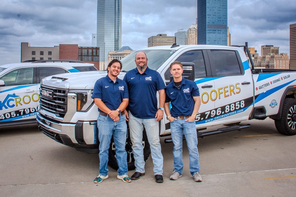 company team standing in front of truck