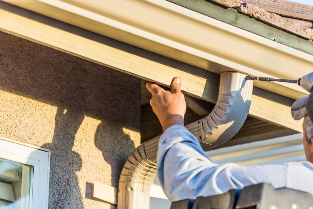 guy installing gutter